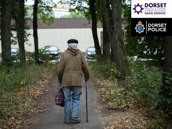 an older man walking with a cane through the woods to a car park, the Dorset Police and Crime Commissioner's logo and the Dorset Police logo